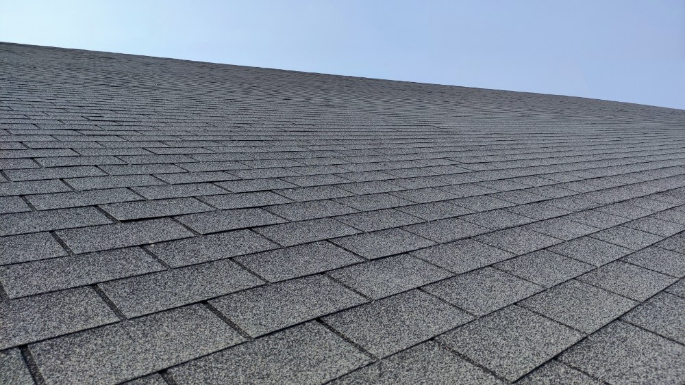 Roof shingles against blue sky