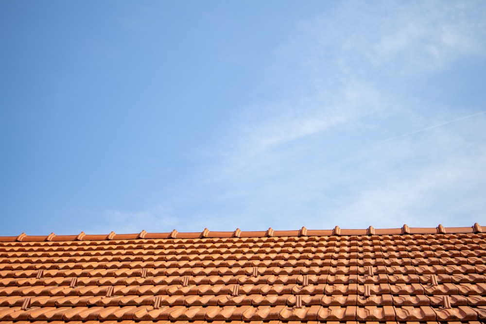 Tile roof against blue sky